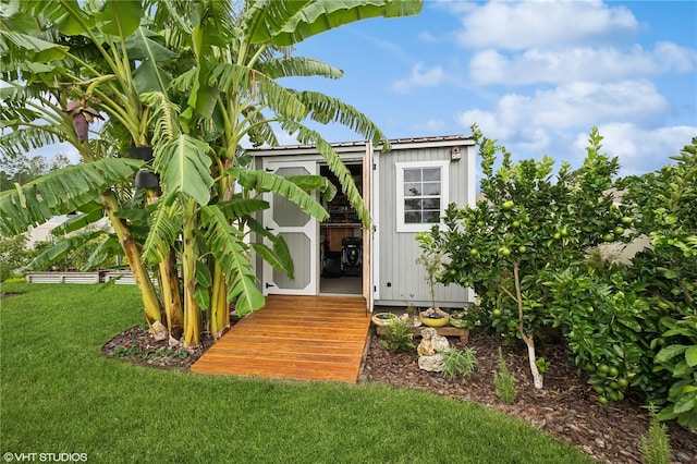 view of outdoor structure with a yard