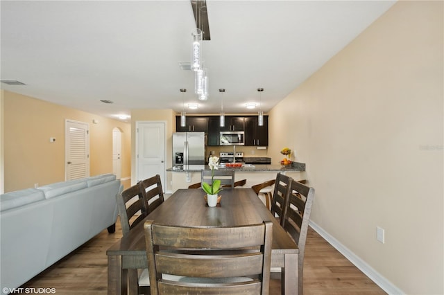 dining room featuring hardwood / wood-style flooring