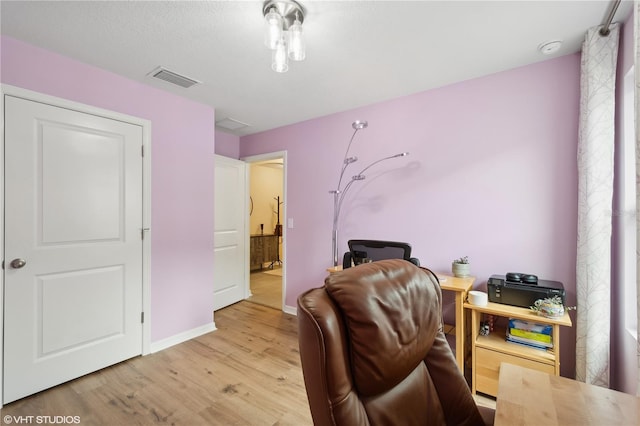 office area with light hardwood / wood-style flooring