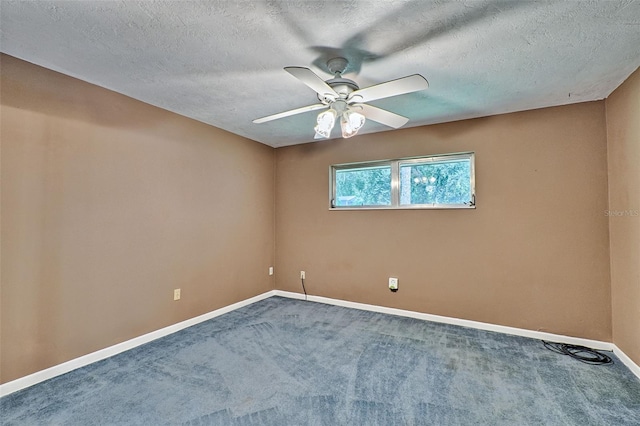 carpeted empty room featuring baseboards, a textured ceiling, and a ceiling fan