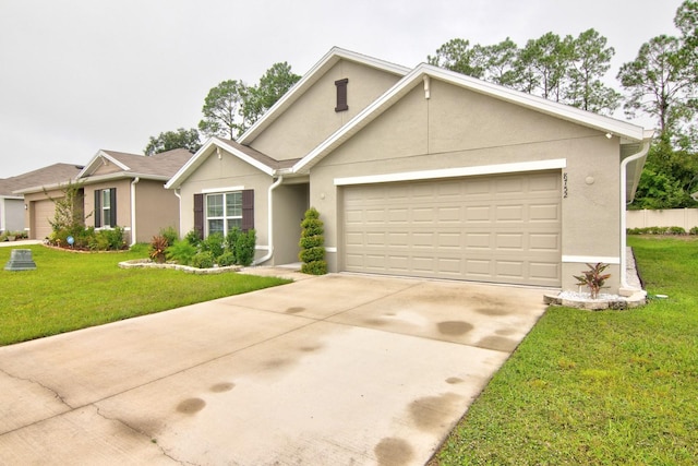 view of front facade featuring a garage and a front yard