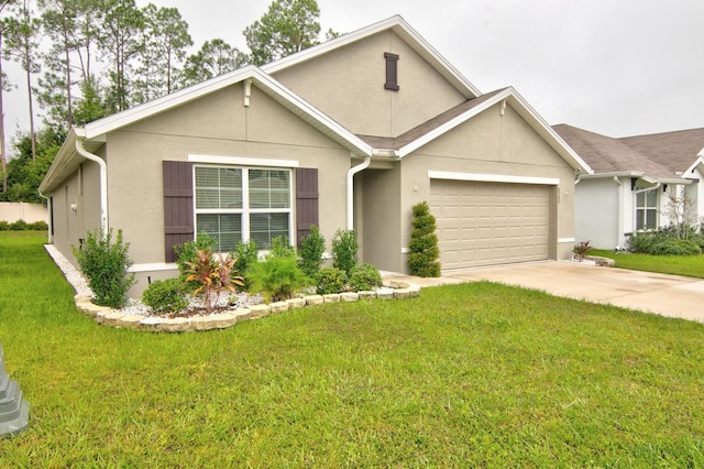 view of front of house featuring a garage and a front lawn