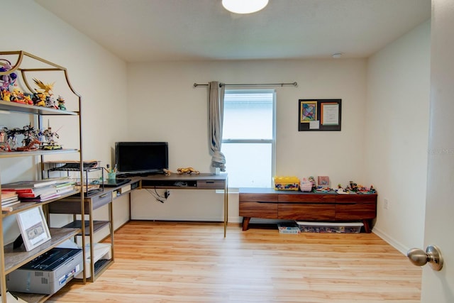 home office featuring light hardwood / wood-style floors