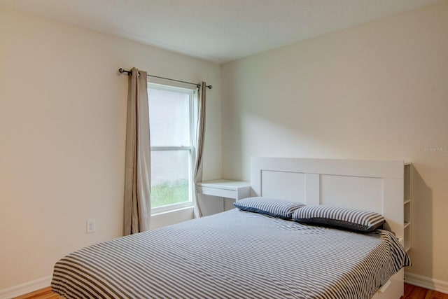 bedroom with light hardwood / wood-style floors