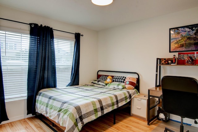 bedroom with light hardwood / wood-style flooring