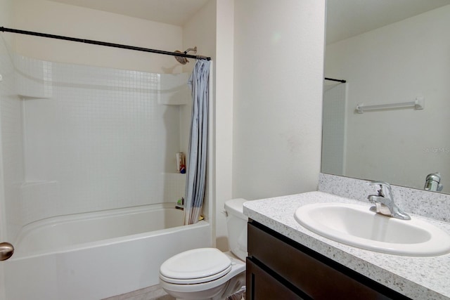 full bathroom featuring vanity, toilet, and shower / bath combination with curtain