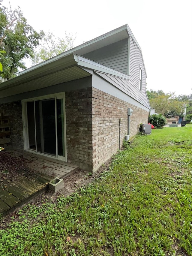 view of home's exterior featuring a lawn