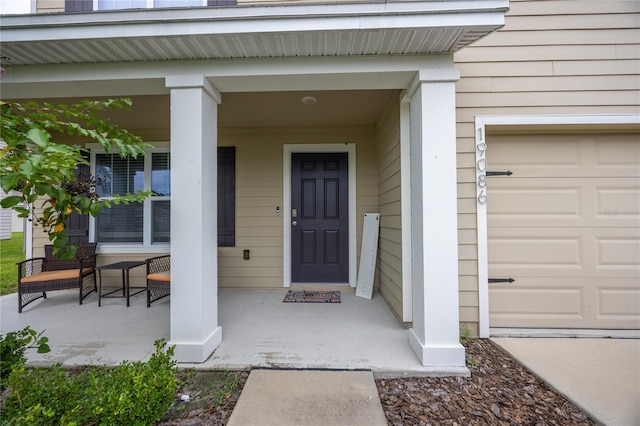 property entrance featuring a porch