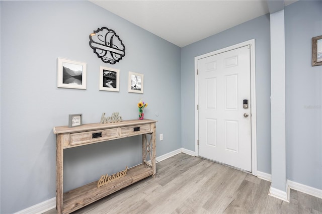 foyer entrance with light hardwood / wood-style flooring