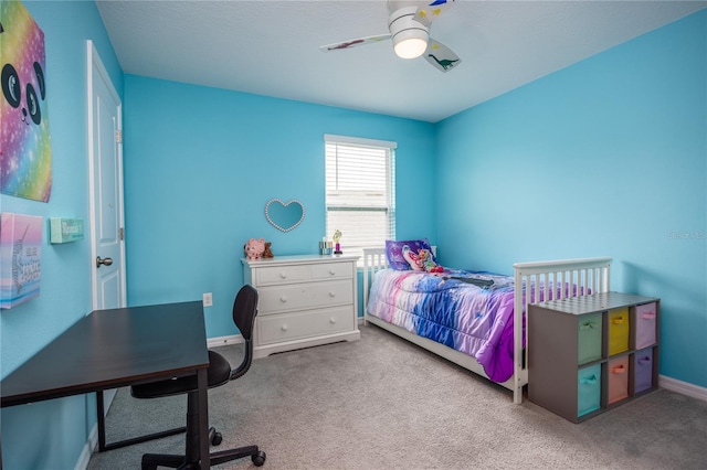 carpeted bedroom with ceiling fan