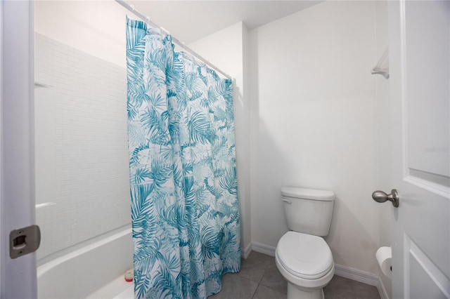 bathroom featuring shower / tub combo, toilet, and tile patterned floors