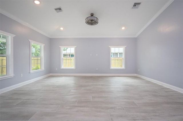 unfurnished room with crown molding