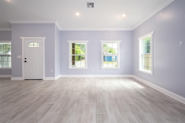 entryway featuring light hardwood / wood-style flooring and crown molding