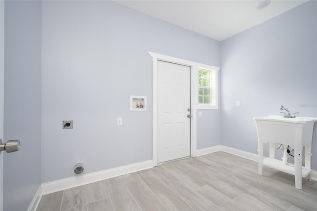 laundry room with light hardwood / wood-style floors, electric dryer hookup, and washer hookup