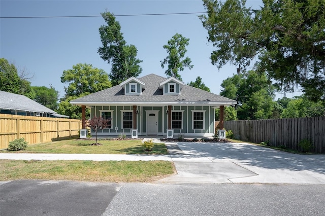 view of front facade with a front lawn and a porch