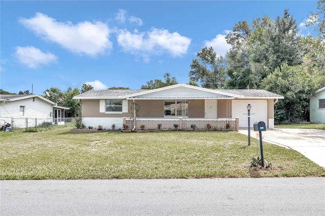 ranch-style home with covered porch and a front yard