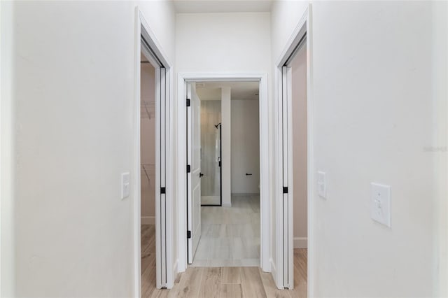 hall with light wood-type flooring