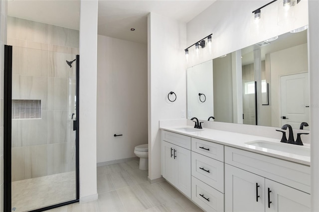 bathroom featuring walk in shower, vanity, and toilet