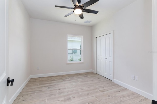 empty room featuring light hardwood / wood-style floors and ceiling fan