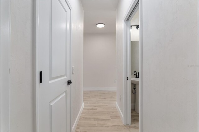 corridor featuring light hardwood / wood-style floors