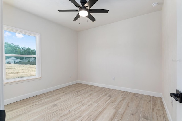 empty room with light wood-type flooring and ceiling fan