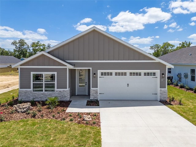 craftsman-style home with a front lawn and a garage