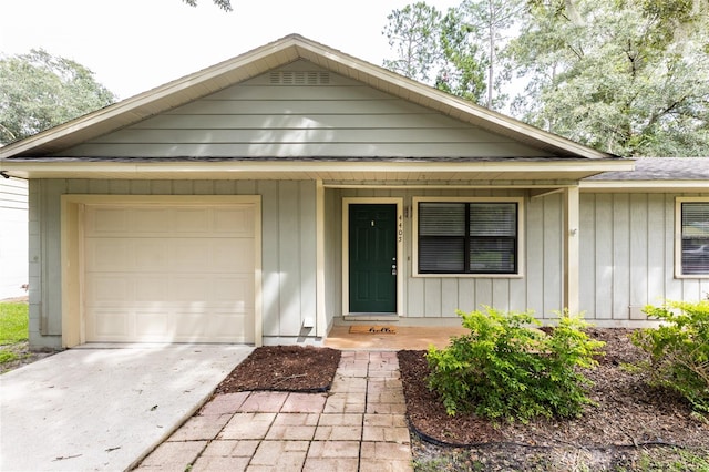 view of front of house featuring a porch and a garage