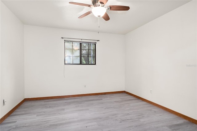 empty room with light wood-type flooring and ceiling fan