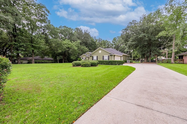 ranch-style house with a front yard