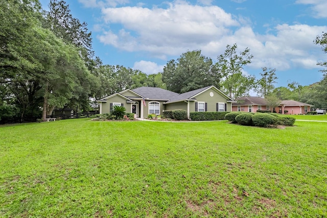 single story home featuring a front yard