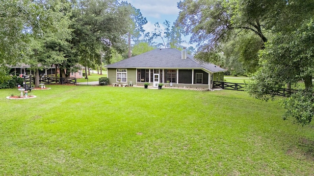 view of yard featuring a sunroom