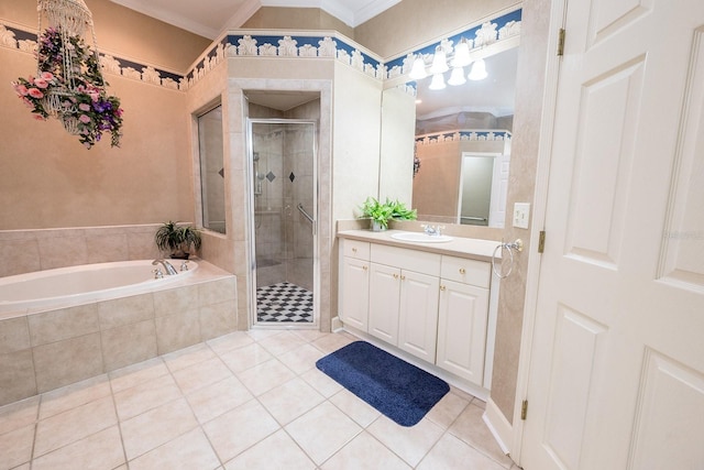 bathroom with independent shower and bath, vanity, ornamental molding, and tile patterned floors