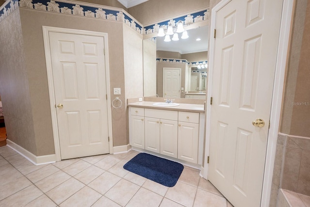 bathroom featuring ornamental molding, tile patterned flooring, and vanity