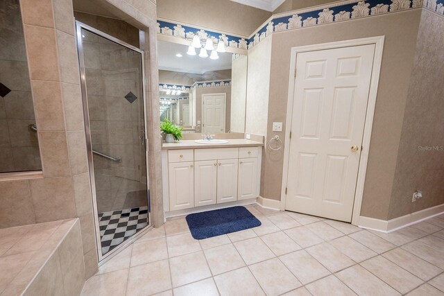 bathroom featuring ornamental molding, tile patterned flooring, an enclosed shower, and vanity