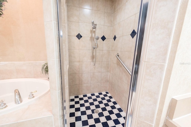 bathroom with shower with separate bathtub