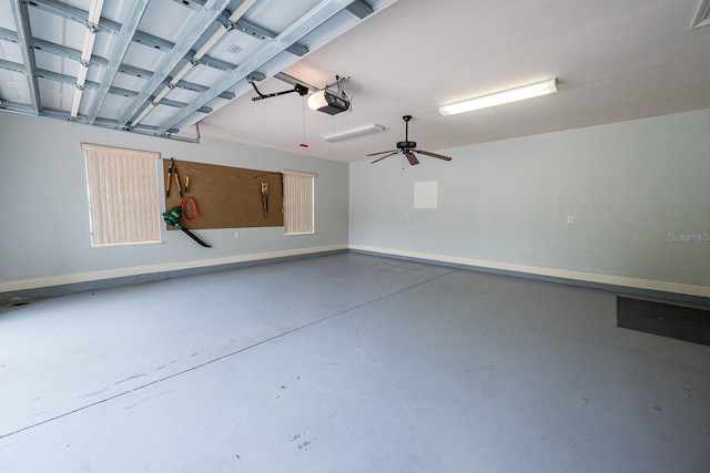 garage with ceiling fan and a garage door opener