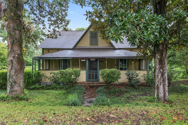 view of front of house with a front lawn and covered porch