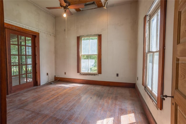 spare room featuring ceiling fan and hardwood / wood-style flooring