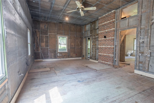 unfurnished room featuring hardwood / wood-style floors and ceiling fan