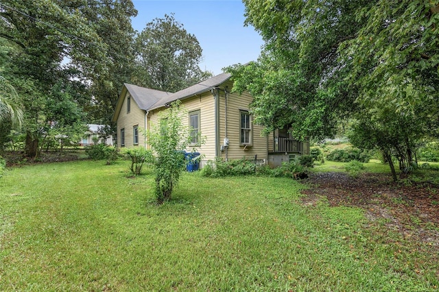 view of property exterior with a lawn