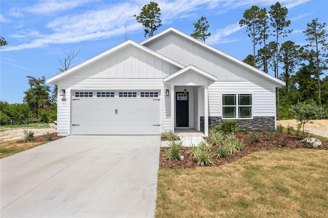 view of front of house featuring a front yard and a garage