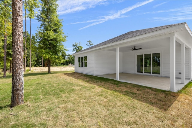 view of yard featuring ceiling fan and a patio area