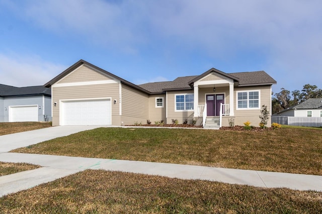 view of front facade with a front yard and a garage