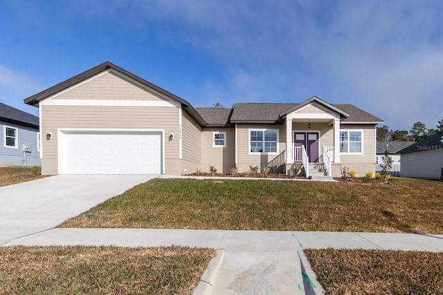 view of front facade featuring a garage and a front lawn