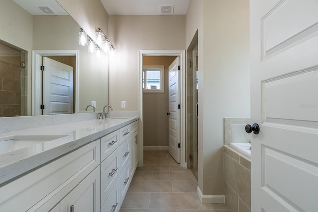 bathroom featuring tile patterned floors, separate shower and tub, and vanity