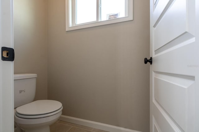 bathroom featuring toilet and tile patterned floors