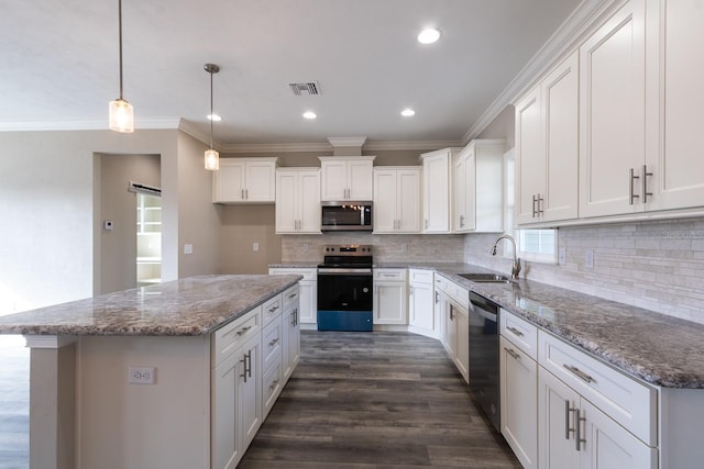 kitchen featuring appliances with stainless steel finishes, white cabinetry, and sink