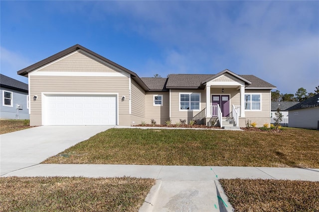 view of front facade with a garage and a front lawn