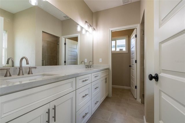 bathroom with vanity and tile patterned floors