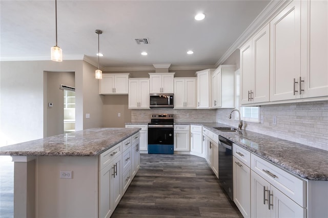 kitchen featuring sink, white cabinets, a kitchen island, and appliances with stainless steel finishes